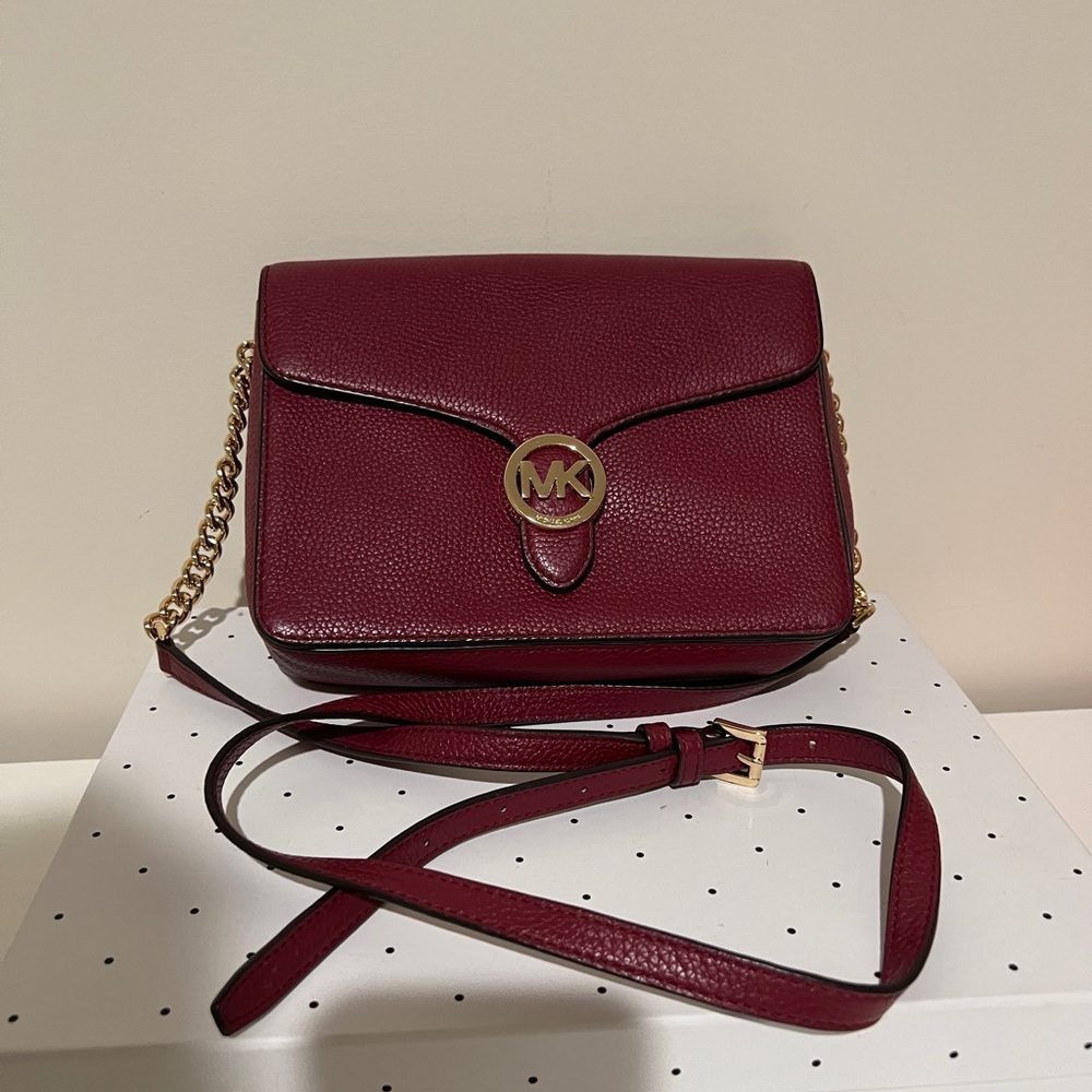 Is a Michael kors crossbody bag in burgundy red very pretty color